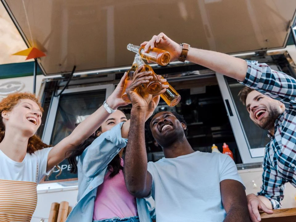 Residents enjoying drinks together at an apartment community social event