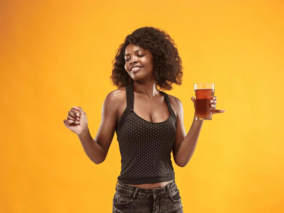 Resident enjoying a drink at a beer tasting event.