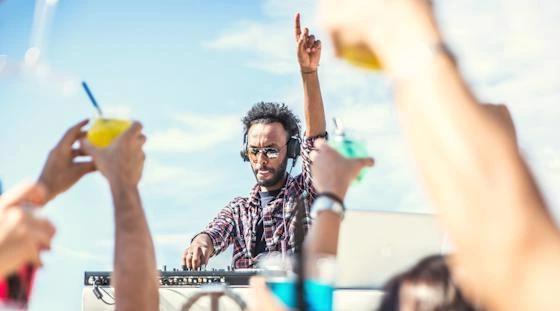 DJ performing at a pool party for apartment community residents.