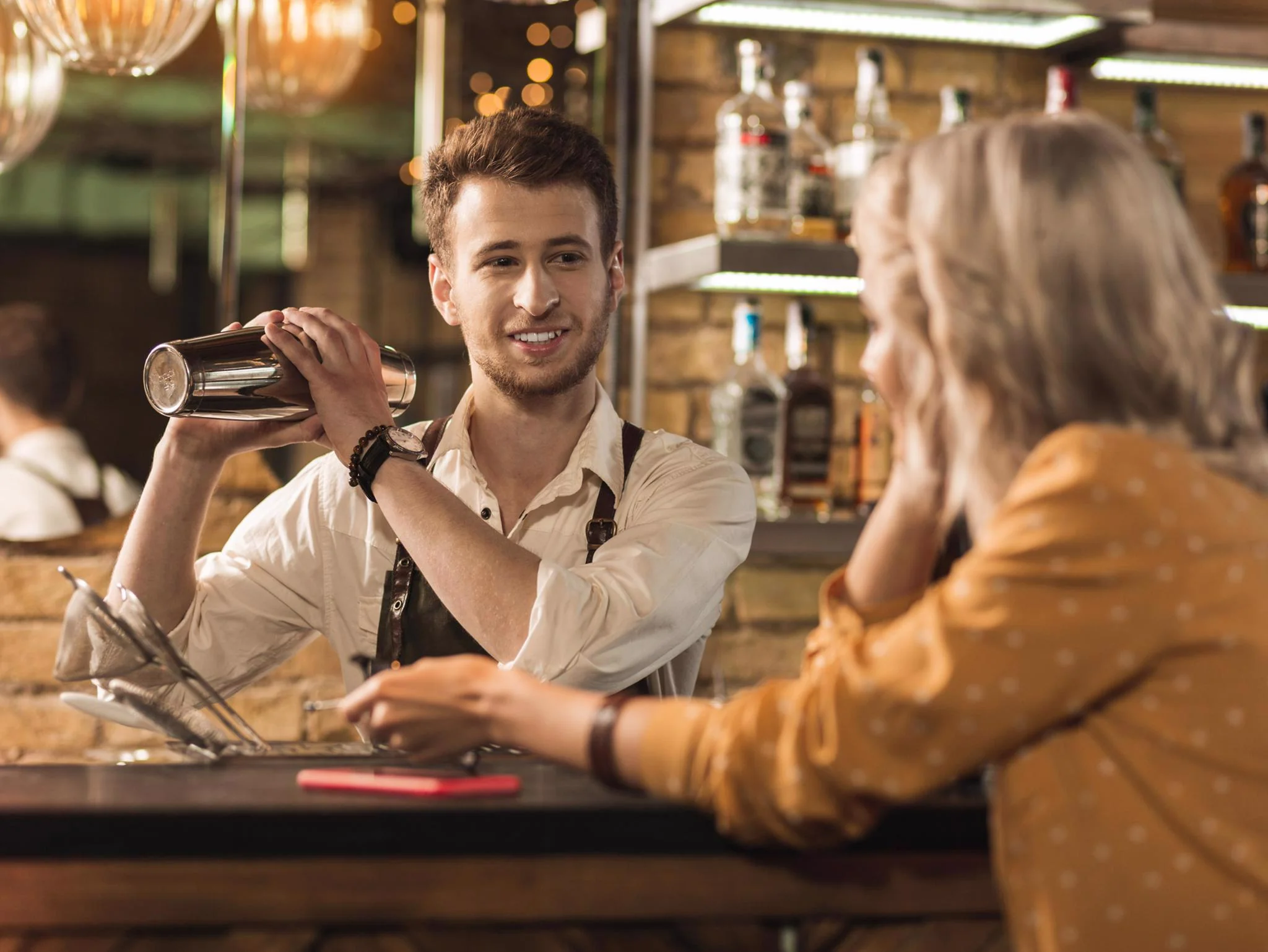 Bartender preparing a drink for a guest during Open House Fall Festivities
