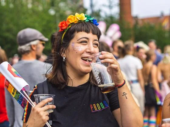 Guest celebrating Pride at an outdoor happy hour event