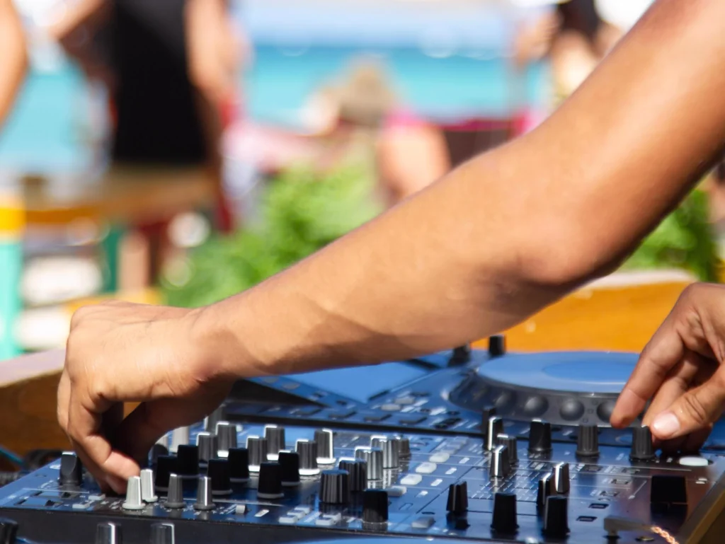DJ mixing music at a 4th of July outdoor party