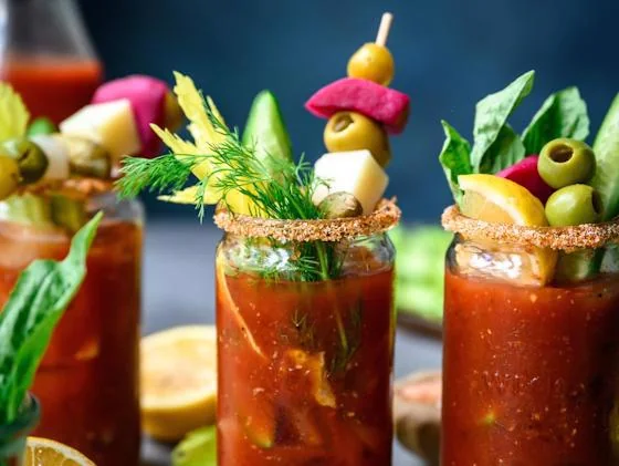 Bloody Mary cocktails with fresh garnishes at an open bar
