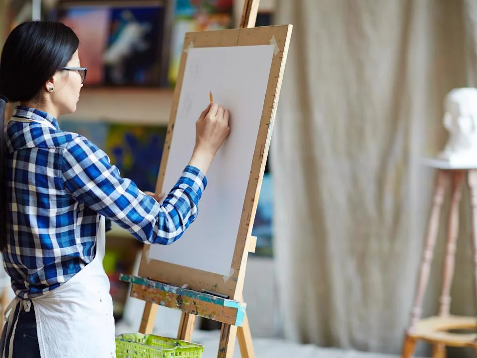 Artist drawing a caricature portrait at a resident event