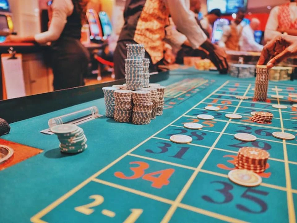 Casino roulette table with colorful chips during an elegant casino night event