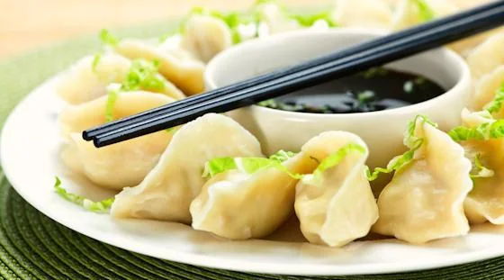 Chinese dumplings served with dipping sauce