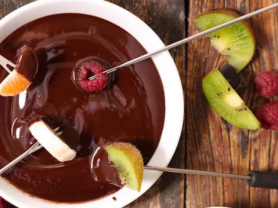 Chocolate fondue with fresh fruit and dipping skewers