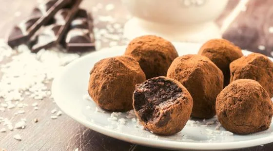 Handmade chocolate truffles dusted with cocoa for a resident cooking class