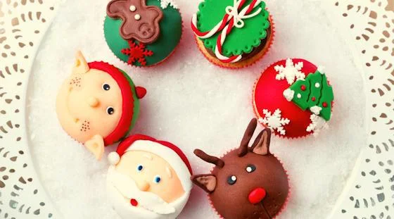 Festive decorated cupcakes with Santa, reindeer and Christmas designs