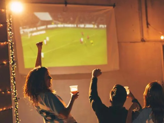 Residents watching Game Day together at an apartment community event
