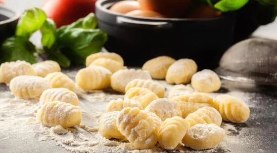 Fresh homemade Italian gnocchi on a floured surface