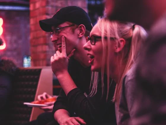 Friends enjoying a Halloween trivia night at a bar