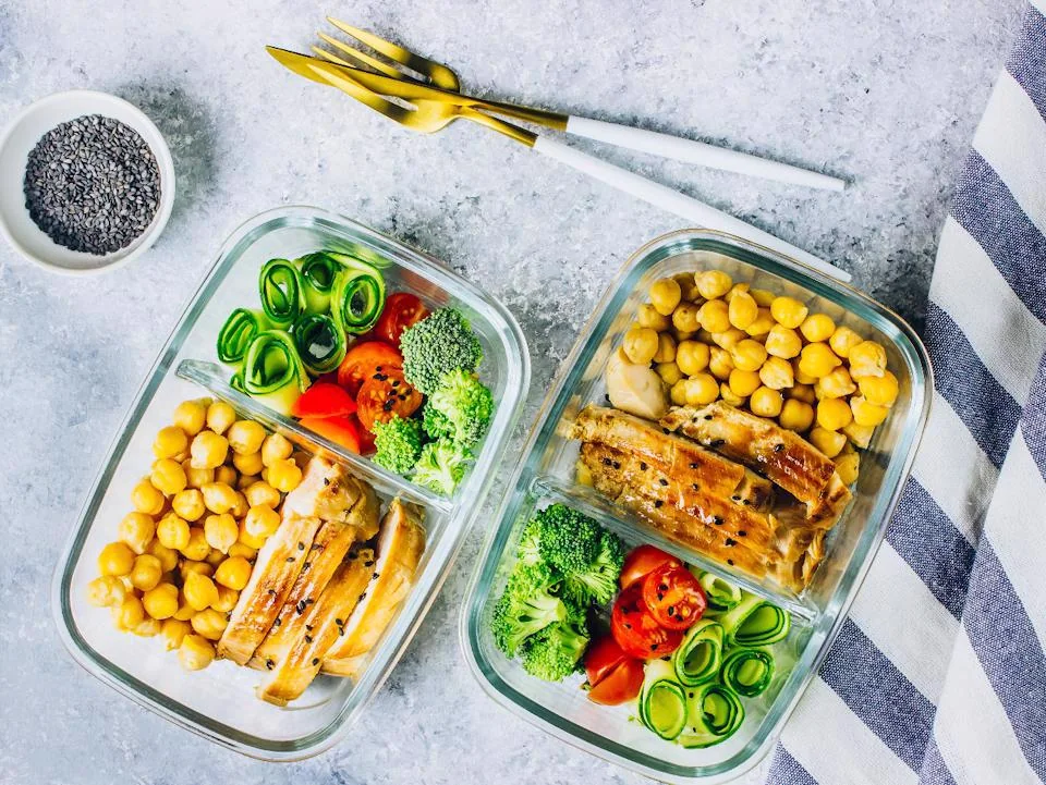 Healthy prepared meals with eggs, vegetables and fresh fruit