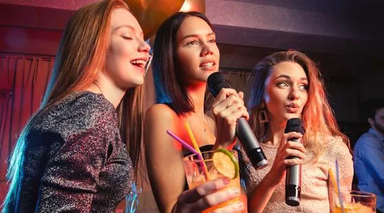 Residents singing at an apartment community karaoke night