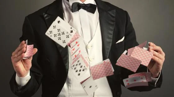 Magician performing a flying card trick