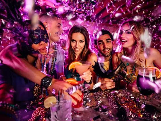 Residents celebrating Mardi Gras together with festive drinks and masks