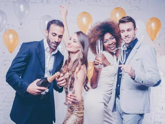 Residents celebrating New Year's Eve together with champagne