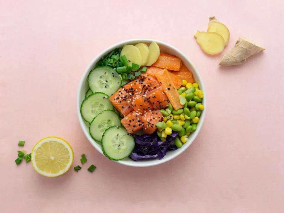 Fresh salmon poke bowl with avocado, cucumber, and vegetables