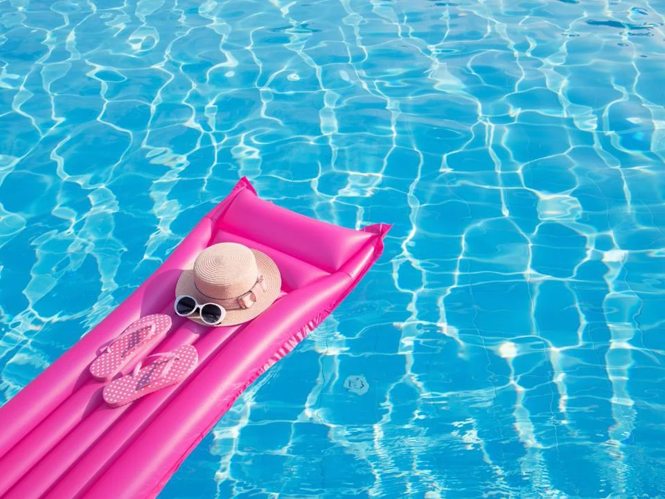 Pink pool float in a sunny swimming pool