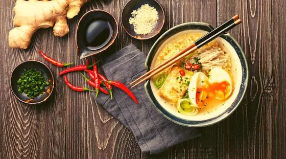 Homemade ramen bowl with egg, noodles and fresh toppings