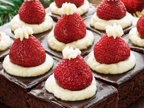 Santa hat brownies topped with strawberries and cream