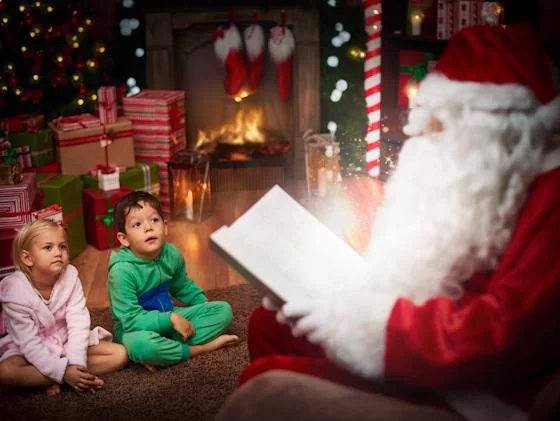 Santa reading a Christmas story to children in a cozy holiday setting