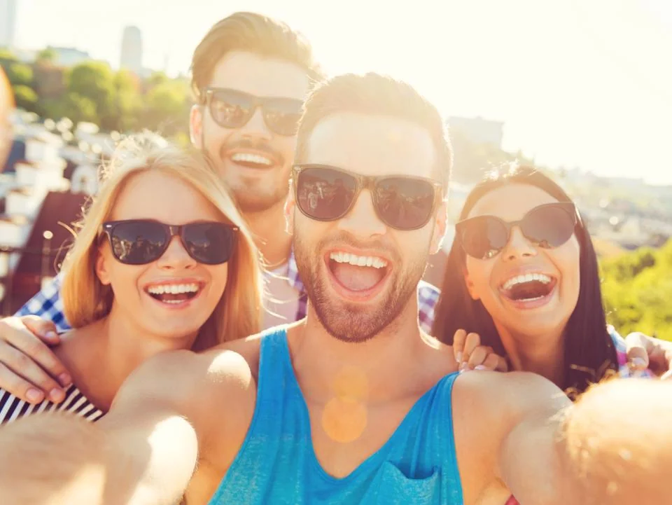 Friends enjoying a summer festival together outdoors