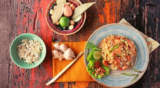 Thai noodle dish with fresh herbs, lime and traditional ingredients
